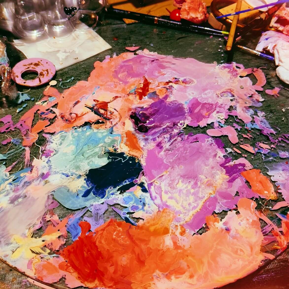 Enamel Color Mixing Process for Custom Enamel Pins Enamel color mixing palette used in custom enamel pin production, showing artistic color blending process for high-quality pins