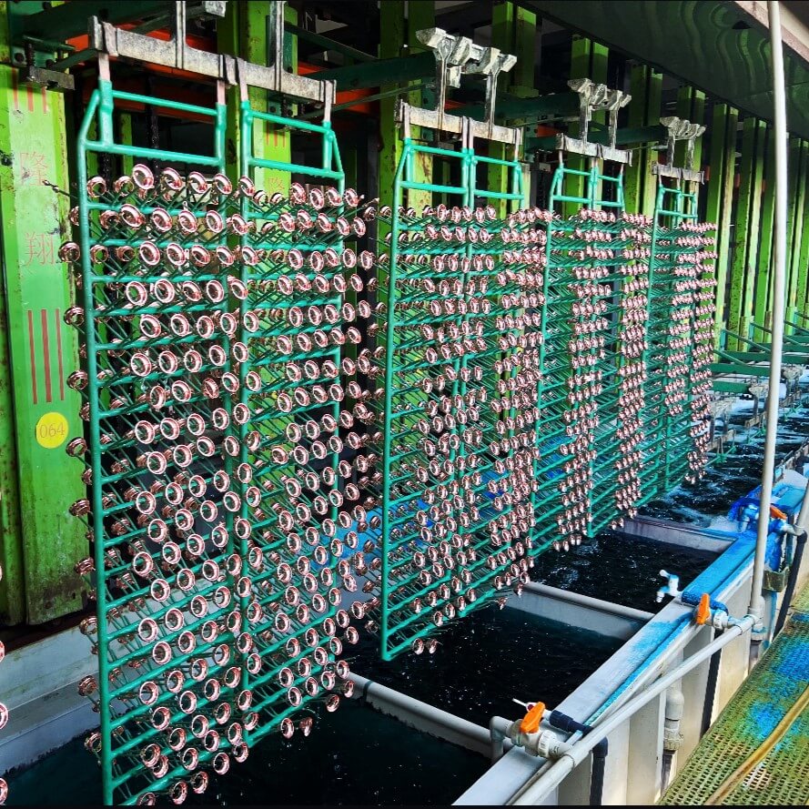 Electroplating Production Line for High-Quality Enamel Pins Factory electroplating and cleaning process for metal components, ensuring durability and finish for high-quality enamel pins