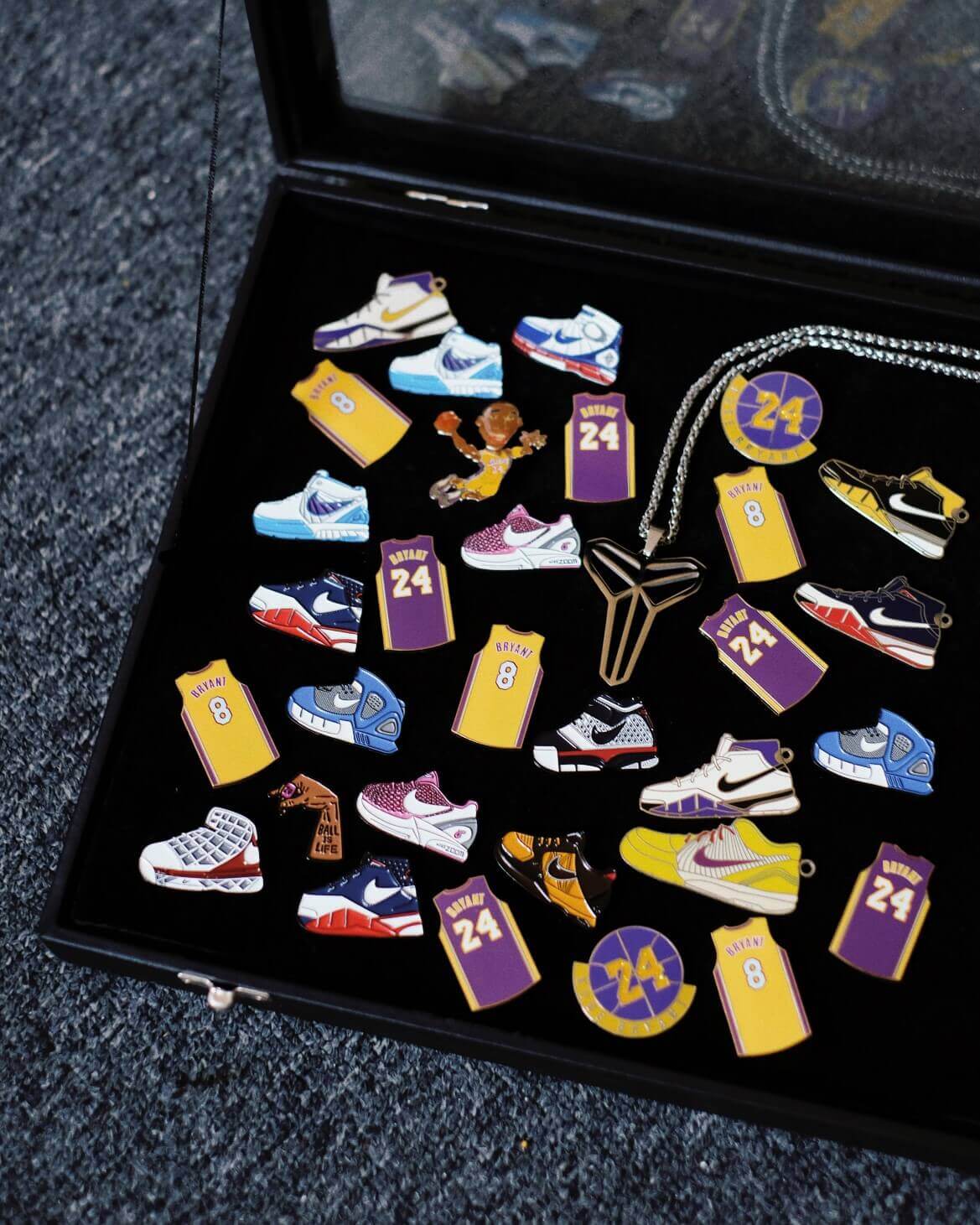 kobe-bryant-basketball-enamel-pin-collection Curated collection of Kobe Bryant basketball enamel pins featuring jerseys #8 and #24, signature sneakers, and Mamba logo – representing sports memorabilia and fan tribute culture through custom pins.