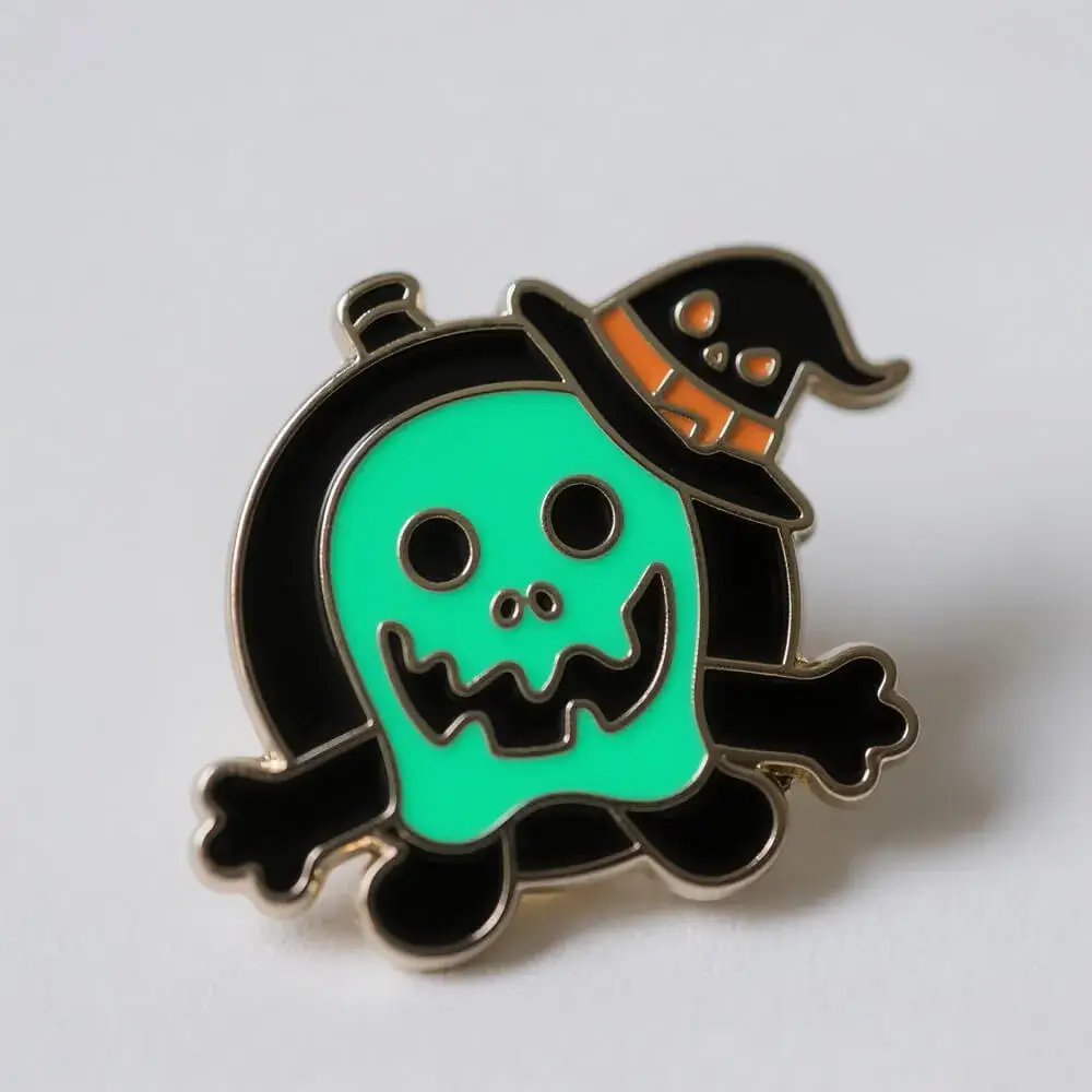 Glow-in-the-dark Halloween-themed badges