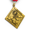 Angled view of unique GUGLE custom medal for awards featuring diamond shape, gold finish, NBTA baton twirling design and flowing red-white-blue ribbon
