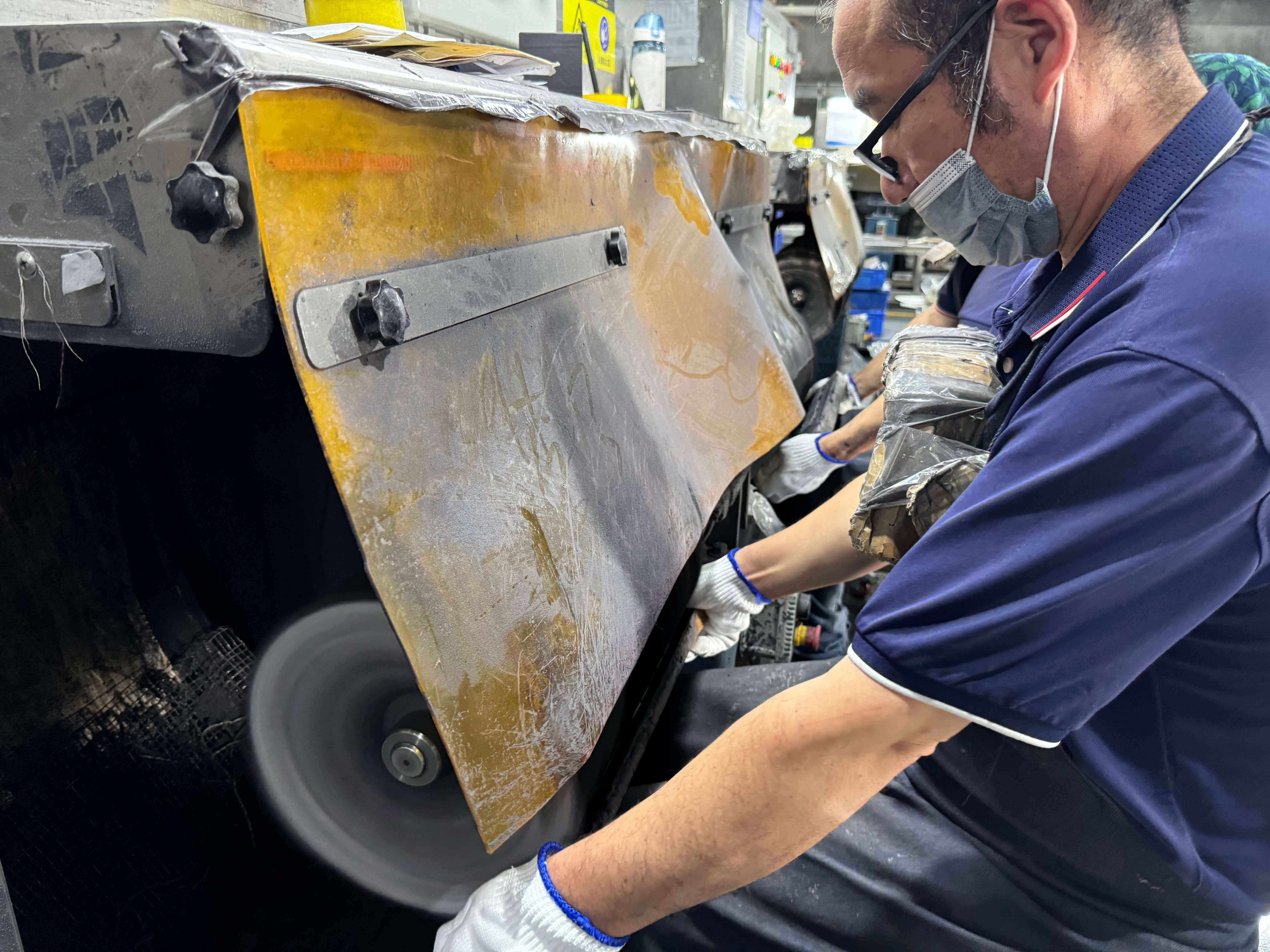 Workers polishing products