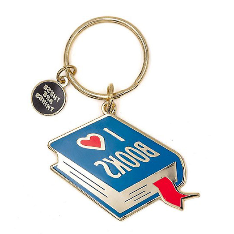 Cute custom enamel book keychain featuring blue 'I ♥ BOOKS' design with red bookmark and gold accents, perfect for book lovers