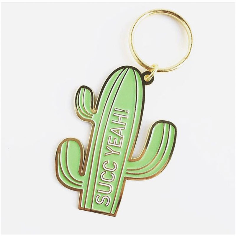 Light green enamel cactus keychain with 'SUCC YEAH!' text