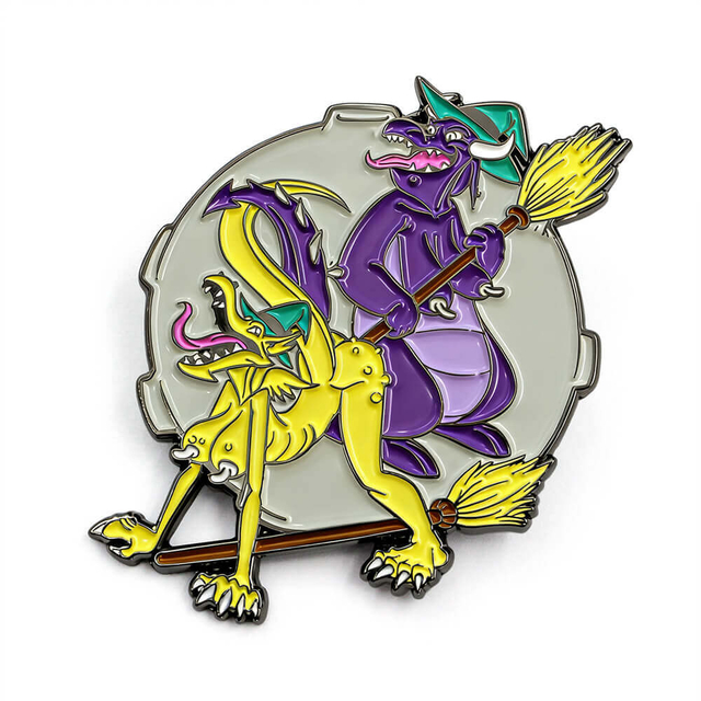 Funny dragon enamel pin featuring purple witch dragon on broomstick with tied yellow dragon in vibrant soft enamel colors