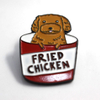 Custom soft enamel lapel pin showing a cute cartoon dog inside a fried chicken bucket, funny food themed enamel pins perfect for cool lapel pins and personalized enamel pins