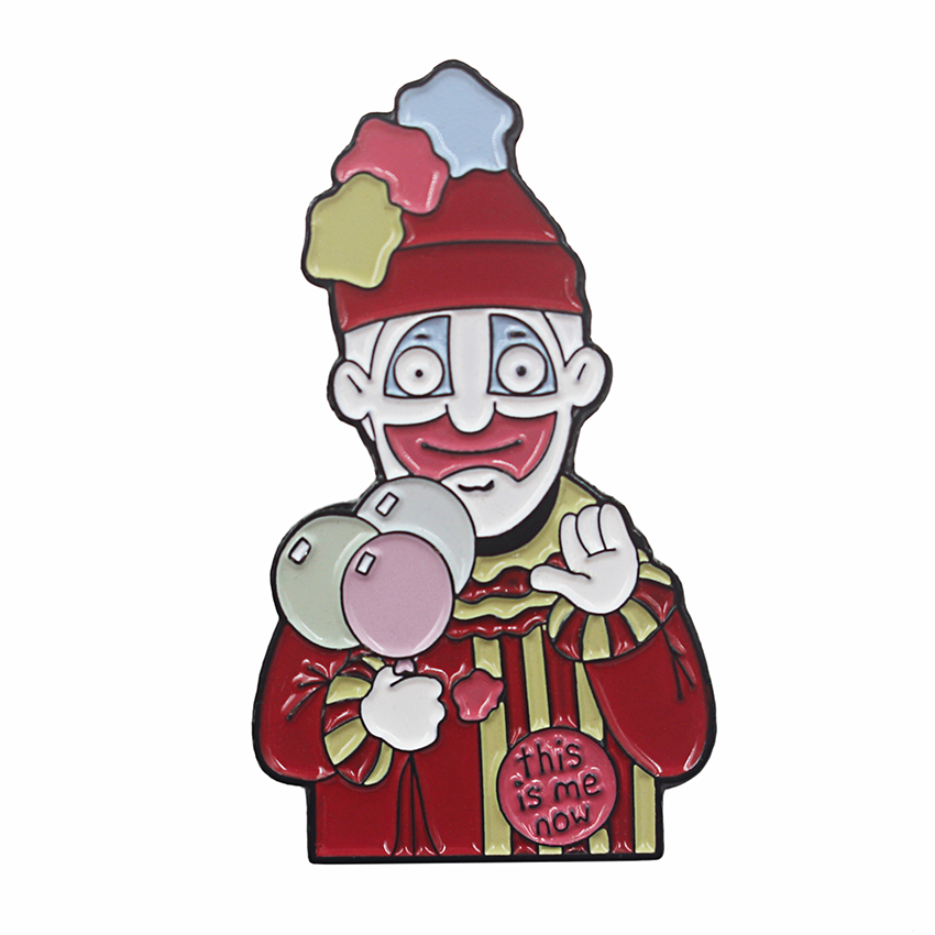 A playful enamel lapel pin featuring a clown in striped outfit, holding a balloon, with "This is me" text, ideal for fun and creative designs.