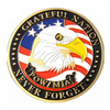 A commemorative POW/MIA challenge coin featuring an American bald eagle under a US flag. The gold-rimmed coin is inscribed with 'GRATEFUL NATION' and 'POW/MIA NEVER FORGET' to honor and remember prisoners of war and those missing in action.