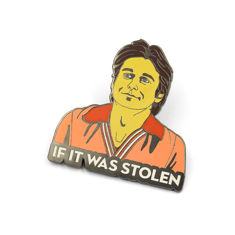 Anime enamel pin held in fingers to show actual size – Johnny Depp Blow movie meme design with 'If It Was Stolen' humorous quote on orange shirt