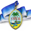 Variety of custom award medals featuring tropical swim palm tree design alongside baton twirling and association medals with colorful ribbons