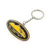 Side view of custom soft enamel military keychain featuring naval ship in black and yellow colors