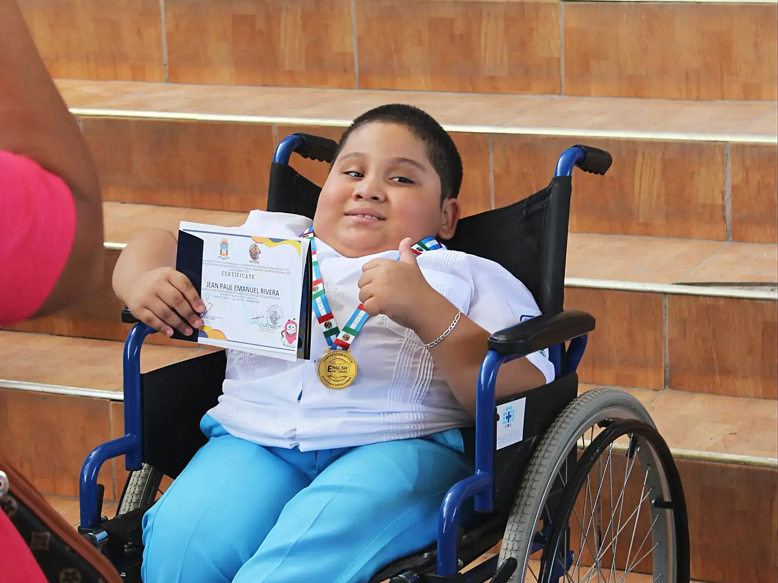 A boy wins a medal.