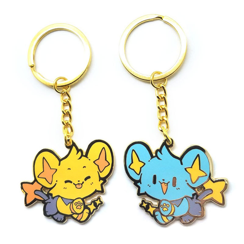 CUGLE kawaii anime keychain duo: yellow and blue Shinx-inspired characters holding stars, gold chain enamel