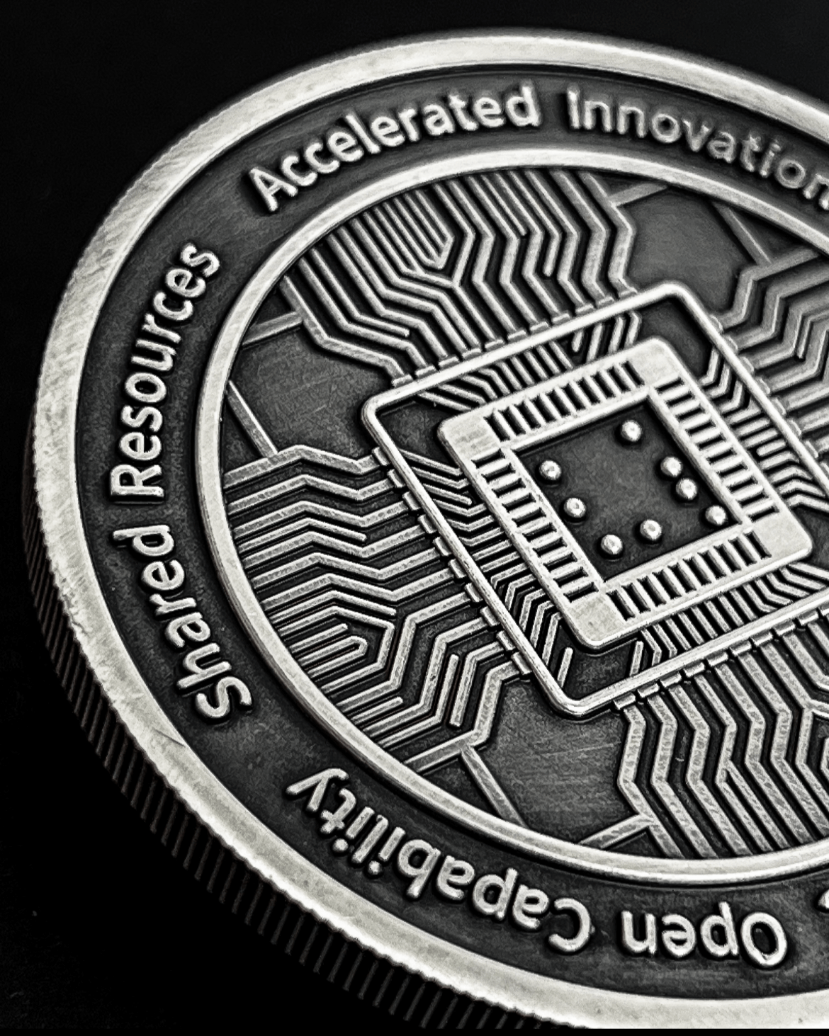 High-detail custom challenge coin with circuit board and innovation text