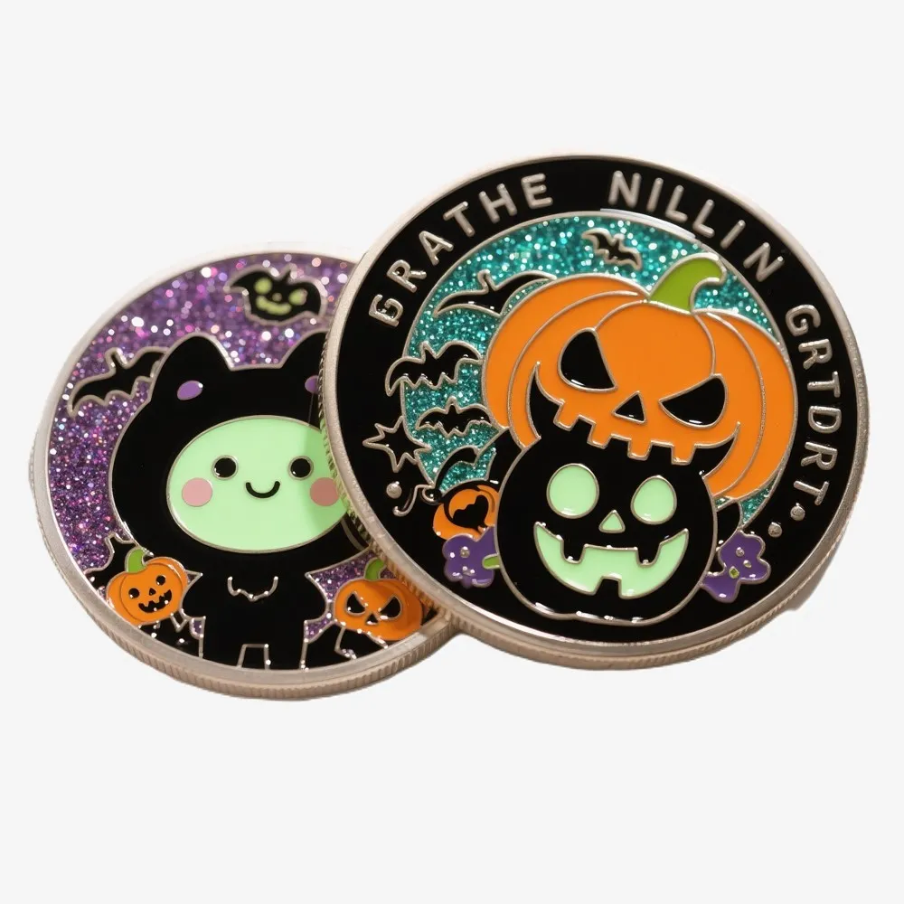 Two colorful Halloween-themed challenge coins featuring pumpkins, bats, skulls, and glitter background details.