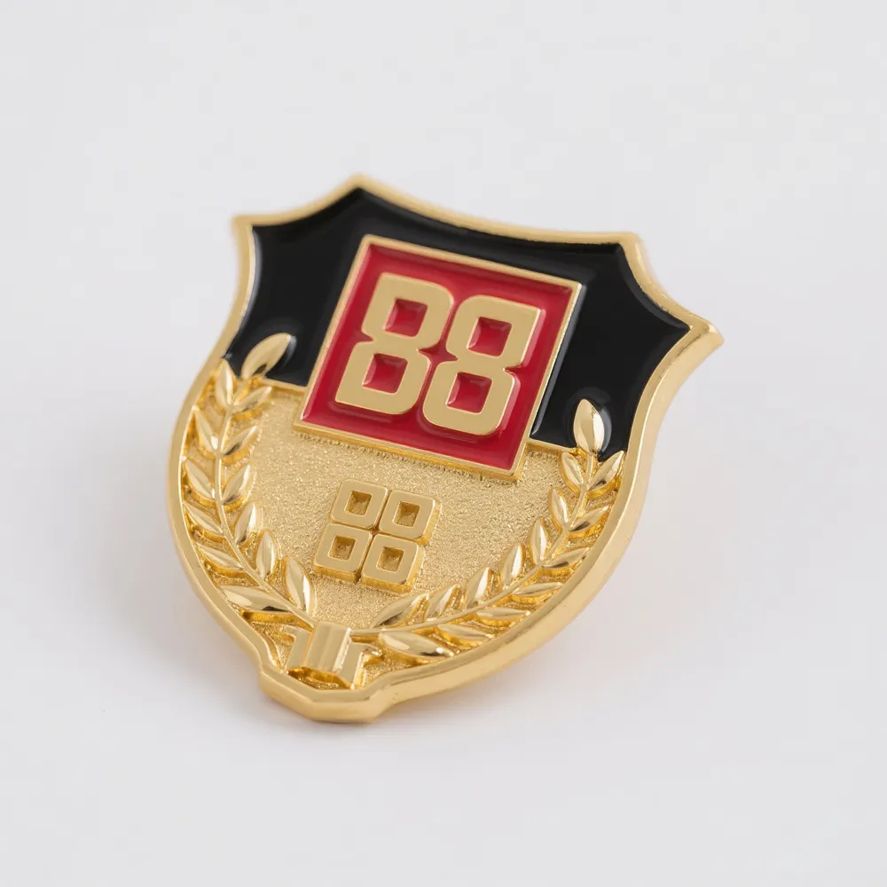 Gold shield-shaped corporate pin with a black enamel background, red “B8” logo, and raised laurel branch details.